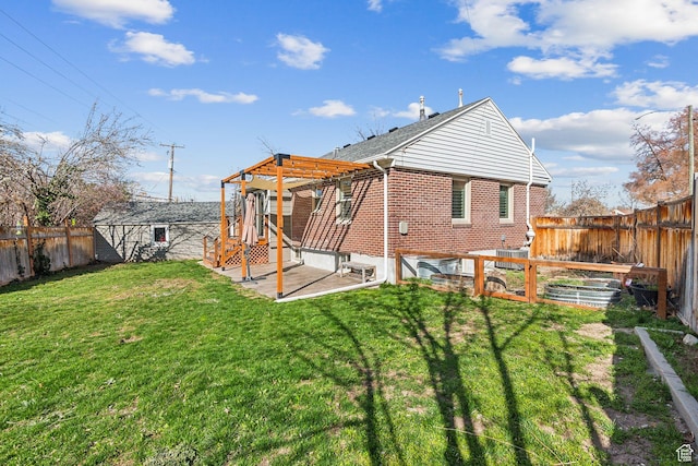 1138 E Hudson Ave, Salt Lake City, UT 84106 - back of house featuring a lawn, a fenced backyard, brick siding, a pergola, and a patio area
