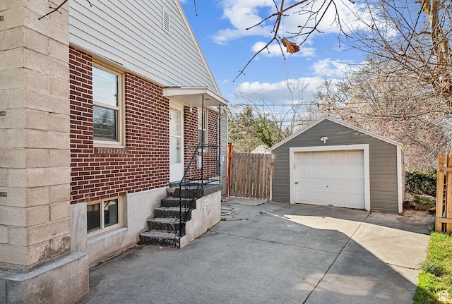 1138 E Hudson Ave, Salt Lake City, UT 84106 - view of side of property with concrete driveway, an outbuilding, fence, brick siding, and a garage
