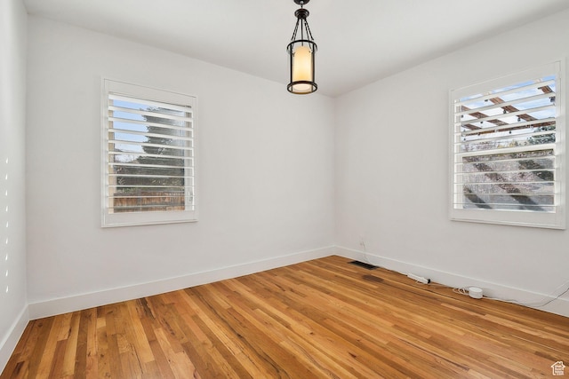 1138 E Hudson Ave, Salt Lake City, UT 84106 - spare room with baseboards, visible vents, and light wood-style floors