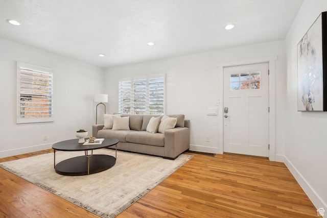 1138 E Hudson Ave, Salt Lake City, UT 84106 - living room featuring baseboards, visible vents, recessed lighting, and light wood-style floors