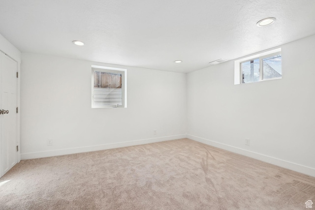 1138 E Hudson Ave, Salt Lake City, UT 84106 - below grade area with carpet, baseboards, a textured ceiling, and recessed lighting