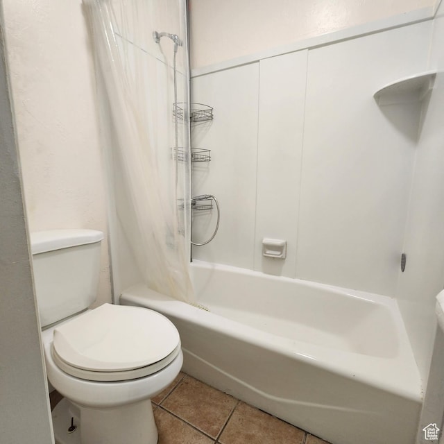 full bath featuring tile patterned floors, toilet, and shower / bath combination with curtain
