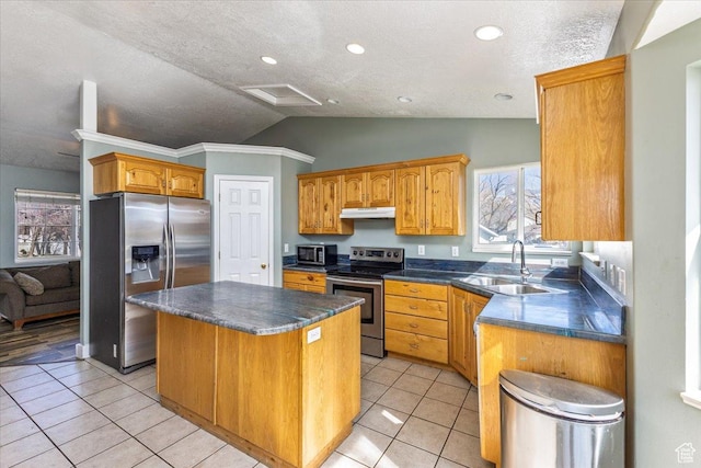 100 Crayon Ct, Logan, UT 84321 - kitchen with dark countertops, a sink, a center island, stainless steel appliances, and lofted ceiling