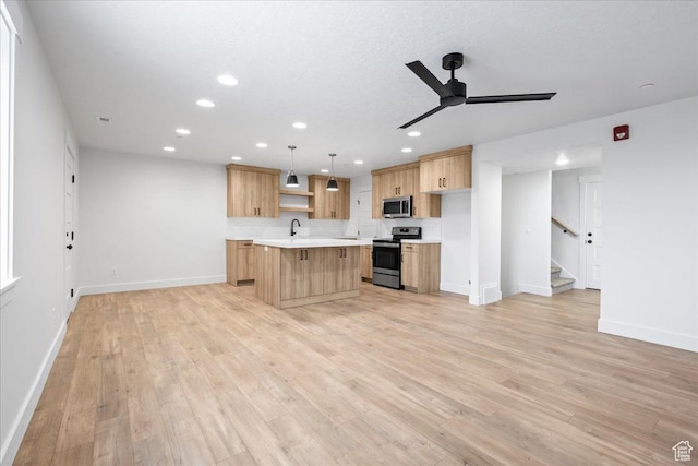 2230 S 635 W Unit B, Perry, UT 84302 - kitchen featuring light countertops, stainless steel appliances, light brown cabinetry, ceiling fan, and light wood-style flooring