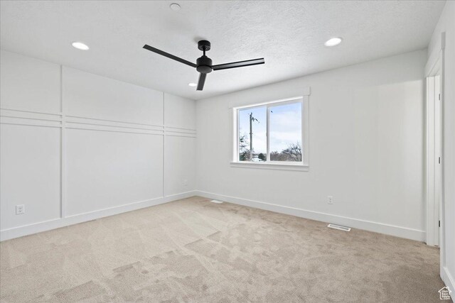 2230 S 635 W Unit B, Perry, UT 84302 - empty room with light colored carpet, recessed lighting, a textured ceiling, ceiling fan, and visible vents