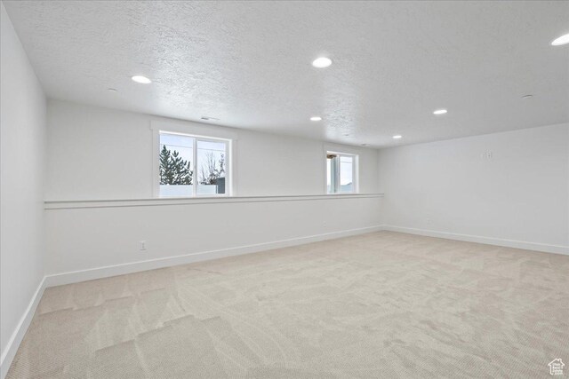 2230 S 635 W Unit B, Perry, UT 84302 - below grade area with baseboards, recessed lighting, and light colored carpet