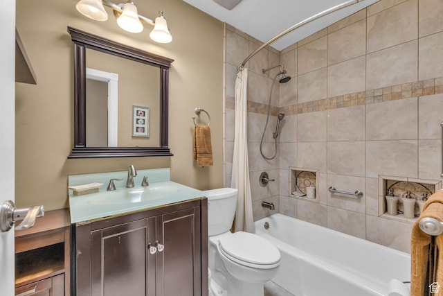 bathroom featuring toilet, shower / tub combo with curtain, and vanity