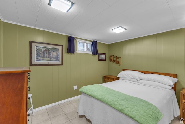 bedroom with light tile patterned floors and baseboards