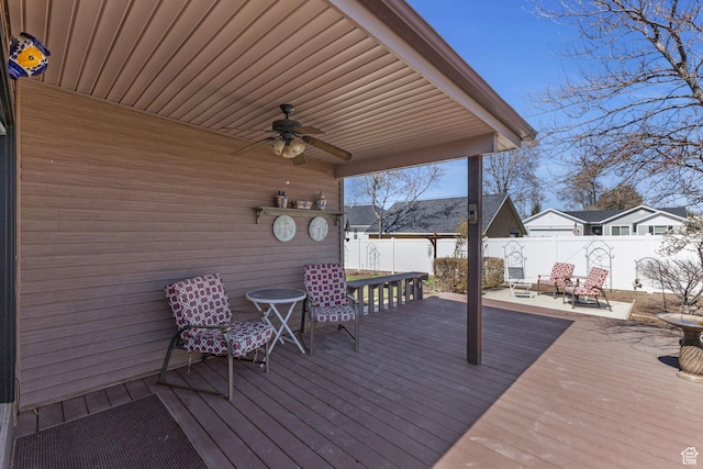 deck featuring a fenced backyard and ceiling fan