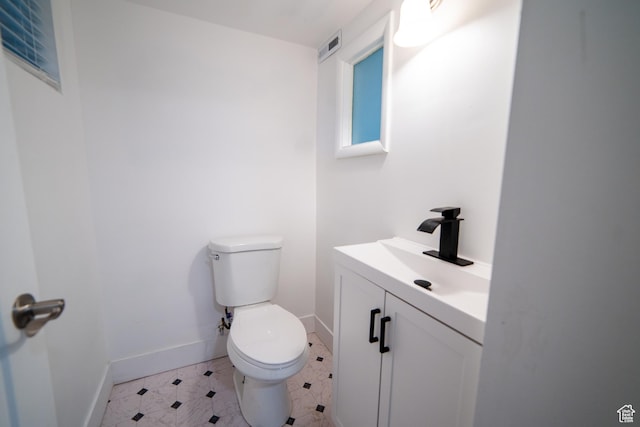 627 W La Salle Dr, Murray, UT 84123 - half bathroom featuring baseboards, visible vents, toilet, and vanity
