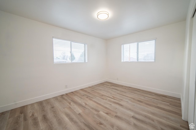 627 W La Salle Dr, Murray, UT 84123 - spare room with plenty of natural light, baseboards, and light wood finished floors