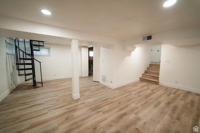 627 W La Salle Dr, Murray, UT 84123 - finished below grade area with stairs, visible vents, light wood-style flooring, and baseboards