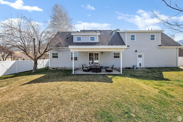 385 N 300 E, Providence, UT 84332 - back of property featuring a patio, a fenced backyard, a shingled roof, outdoor lounge area, and a lawn