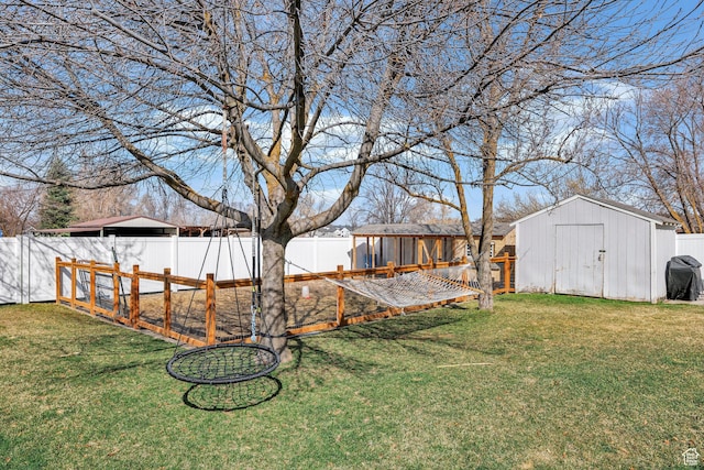 385 N 300 E, Providence, UT 84332 - view of yard featuring an outbuilding, a fenced backyard, and a storage shed