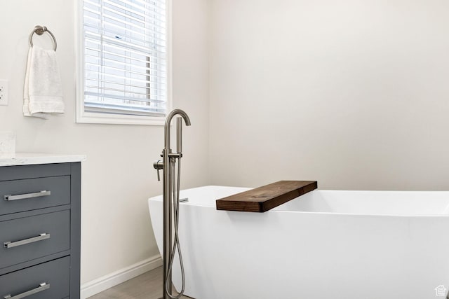 385 N 300 E, Providence, UT 84332 - full bath featuring baseboards, vanity, and a freestanding bath