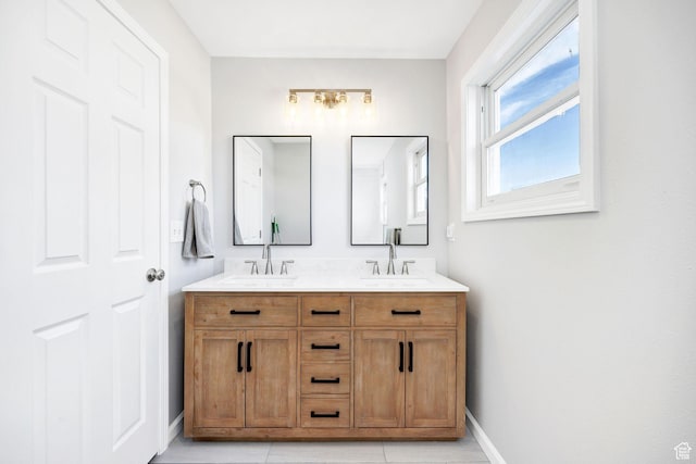 385 N 300 E, Providence, UT 84332 - bathroom with double vanity, a sink, and baseboards