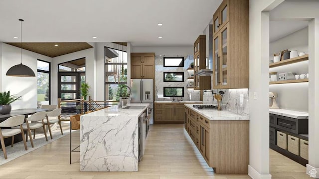 912 W Summit Creek Dr, Woodland Hills, UT 84653 - kitchen featuring appliances with stainless steel finishes, light wood finished floors, light stone countertops, a spacious island, and recessed lighting