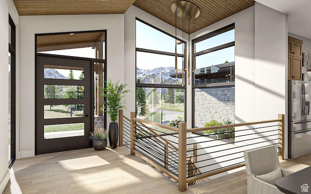 912 W Summit Creek Dr, Woodland Hills, UT 84653 - foyer entrance with a mountain view, light wood-style floors, healthy amount of natural light, and wood ceiling