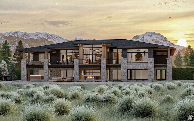 912 W Summit Creek Dr, Woodland Hills, UT 84653 - back of property with a balcony, a mountain view, and stone siding