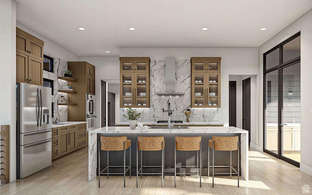 912 W Summit Creek Dr, Woodland Hills, UT 84653 - kitchen with stainless steel appliances, wall chimney range hood, tasteful backsplash, light wood-style floors, and open shelves