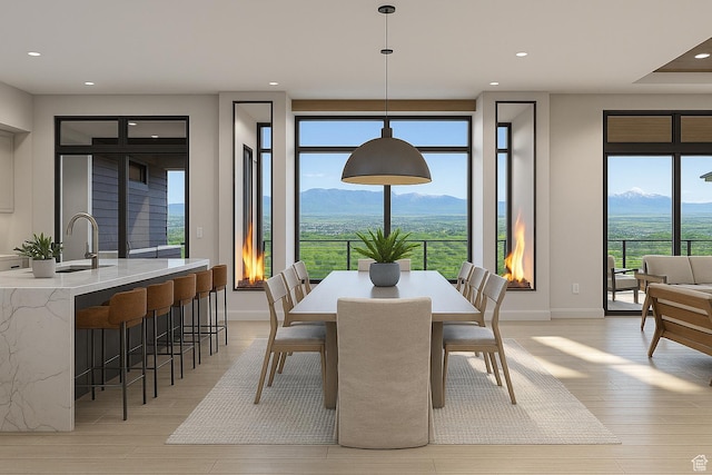 912 W Summit Creek Dr, Woodland Hills, UT 84653 - dining area featuring a mountain view, light wood-style floors, recessed lighting, and baseboards