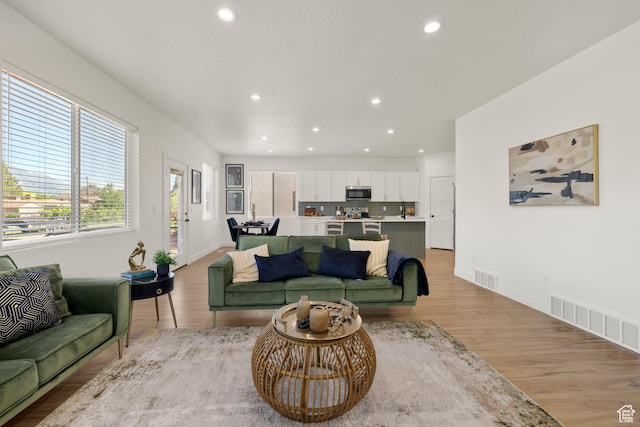514 N 450 W, Orem, UT 84057 - living room featuring recessed lighting, light wood finished floors, and baseboards