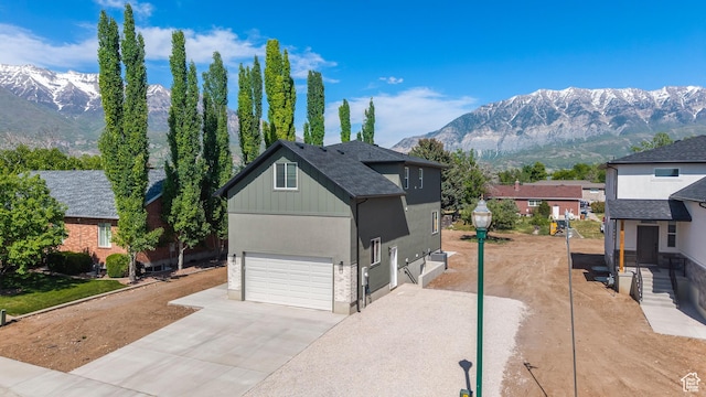514 N 450 W, Orem, UT 84057 - view of front of property with a mountain view, concrete driveway, and an attached garage