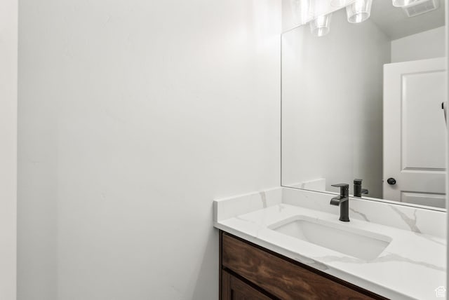 bathroom with vanity and visible vents