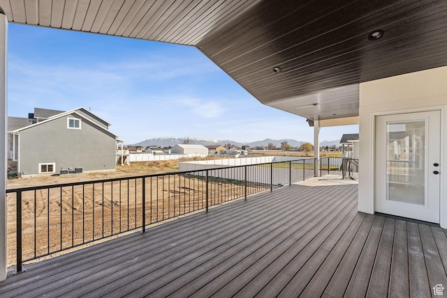 wooden deck with a mountain view
