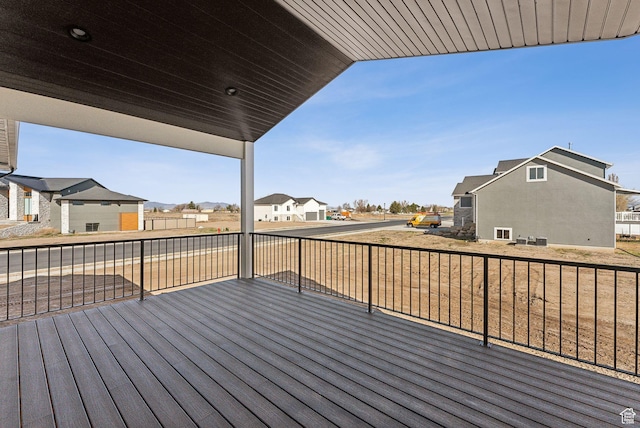 wooden terrace with a residential view