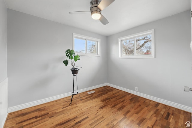 2645 S Masonic Cir E, South Salt Lake, UT 84115 - spare room featuring baseboards, visible vents, wood finished floors, and a ceiling fan