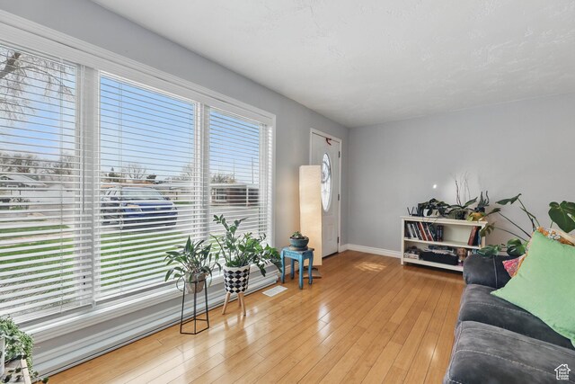 2645 S Masonic Cir E, South Salt Lake, UT 84115 - living room featuring hardwood / wood-style floors and baseboards
