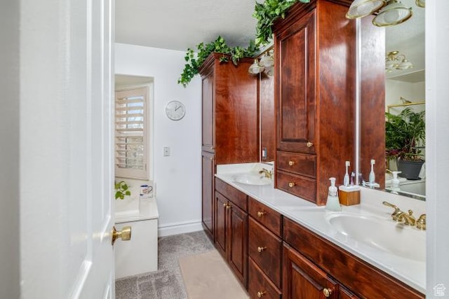 3011 N 1000 W, Pleasant View, UT 84414 - bathroom featuring baseboards, double vanity, and a sink