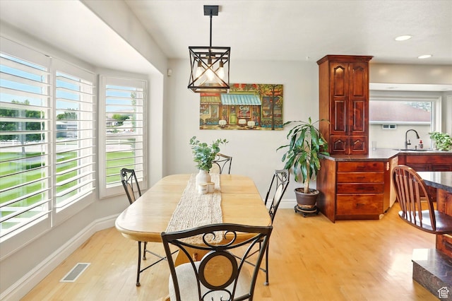 3011 N 1000 W, Pleasant View, UT 84414 - dining area with light wood finished floors and recessed lighting