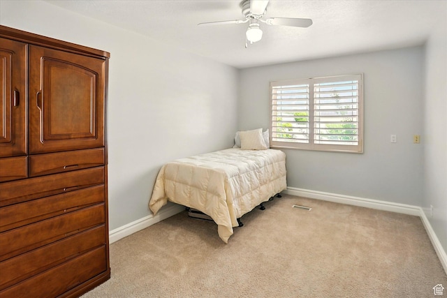 3011 N 1000 W, Pleasant View, UT 84414 - bedroom with light carpet and ceiling fan