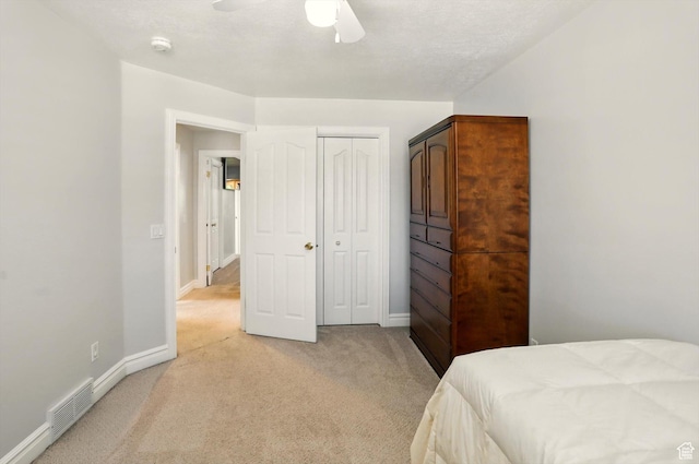 3011 N 1000 W, Pleasant View, UT 84414 - bedroom featuring light colored carpet, a closet, and a ceiling fan