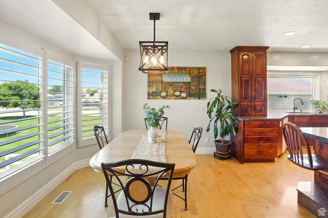 3011 N 1000 W, Pleasant View, UT 84414 - dining space with light wood finished floors and recessed lighting