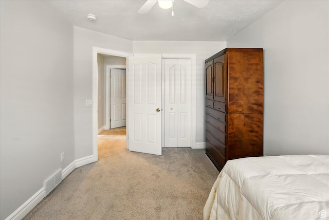 3011 N 1000 W, Pleasant View, UT 84414 - bedroom with light colored carpet, a closet, and a ceiling fan