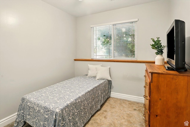 3011 N 1000 W, Pleasant View, UT 84414 - bedroom with baseboards and light carpet
