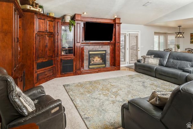 3011 N 1000 W, Pleasant View, UT 84414 - living area featuring a fireplace, vaulted ceiling, and light colored carpet