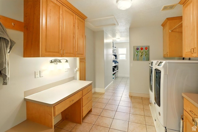3011 N 1000 W, Pleasant View, UT 84414 - laundry room featuring cabinet space, washer and dryer, attic access, and light tile patterned flooring