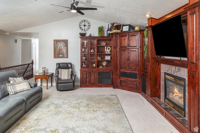 3011 N 1000 W, Pleasant View, UT 84414 - living room with lofted ceiling, ceiling fan, carpet floors, and a tiled fireplace