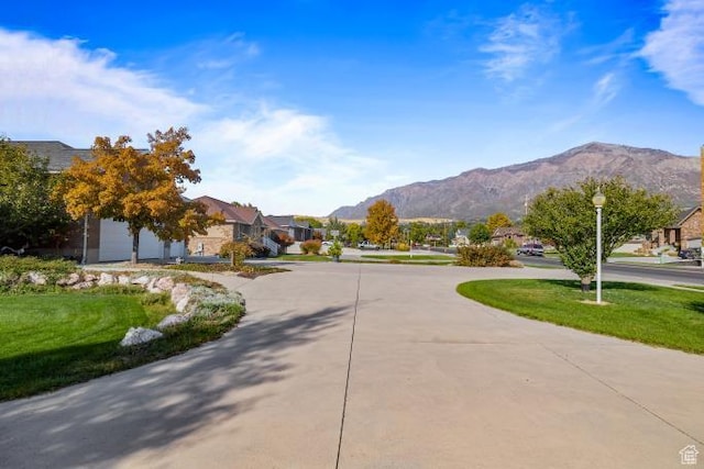 3011 N 1000 W, Pleasant View, UT 84414 - view of road with a residential view, a mountain view, and street lights