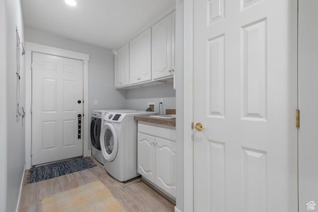 376 W Golden Harvest Rd, Draper, UT 84020 - laundry area featuring separate washer and dryer, light wood-style floors, cabinet space, and a sink