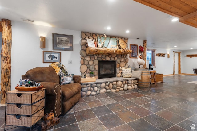 376 W Golden Harvest Rd, Draper, UT 84020 - living area with visible vents, baseboards, a fireplace, recessed lighting, and stone tile flooring