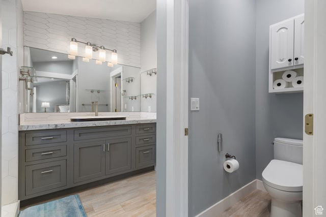 376 W Golden Harvest Rd, Draper, UT 84020 - full bath with toilet, vanity, baseboards, and wood finished floors