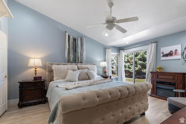 376 W Golden Harvest Rd, Draper, UT 84020 - bedroom with light wood-type flooring, a textured ceiling, lofted ceiling, and access to exterior