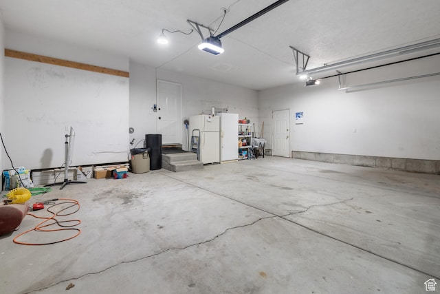 376 W Golden Harvest Rd, Draper, UT 84020 - garage featuring freestanding refrigerator and a garage door opener