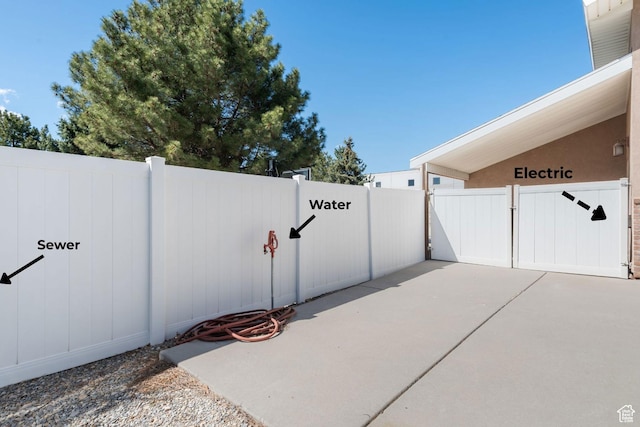 376 W Golden Harvest Rd, Draper, UT 84020 - view of gate featuring a patio and a fenced backyard