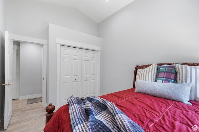376 W Golden Harvest Rd, Draper, UT 84020 - bedroom featuring a closet, baseboards, vaulted ceiling, and light wood-type flooring